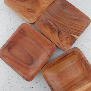 A Set of Four Natural Wooden Trays